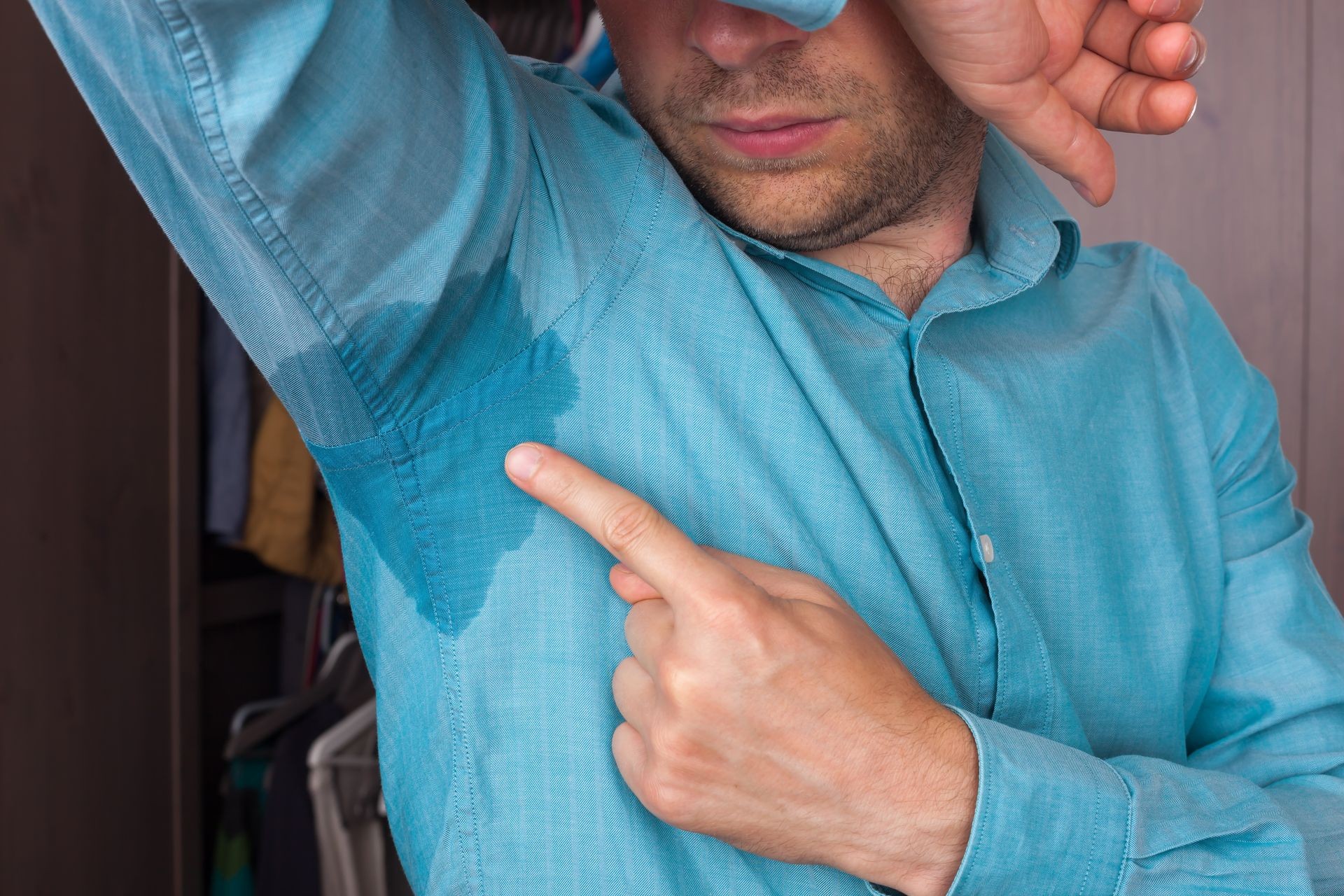 Sweaty spot on the shirt because of the heat, worries and diffidence Sweaty spot on the shirt because of the heat, worries and diffidence